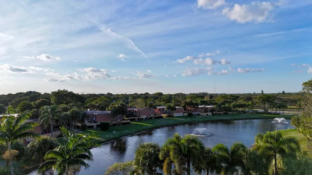 a view of a lake with houses in the back