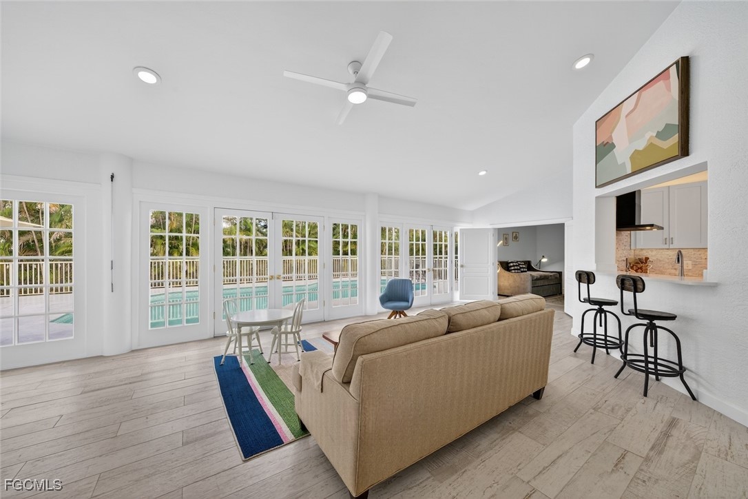 13570 Harbour Ridge Drive Fort Myers, FL 33908 - Photo 19 of 50 a living room with furniture and a large window