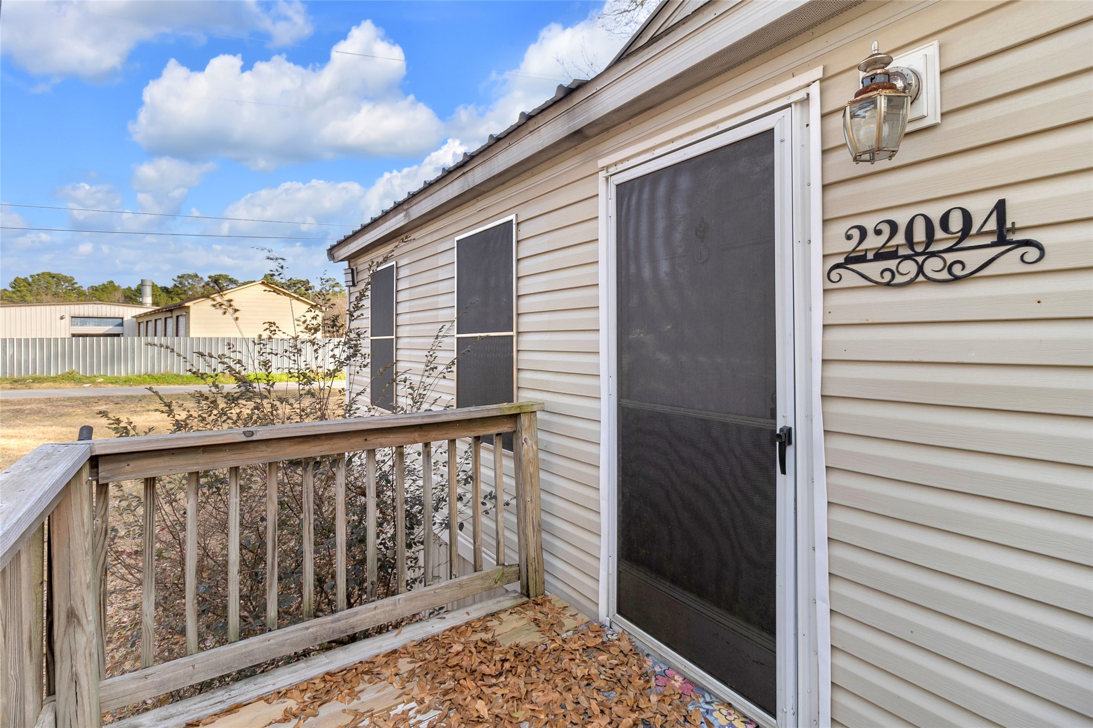22094 Spear Road Porter, TX 77365 - Photo 6 of 45 Primary front access door offering easy and direct entry to the residence.