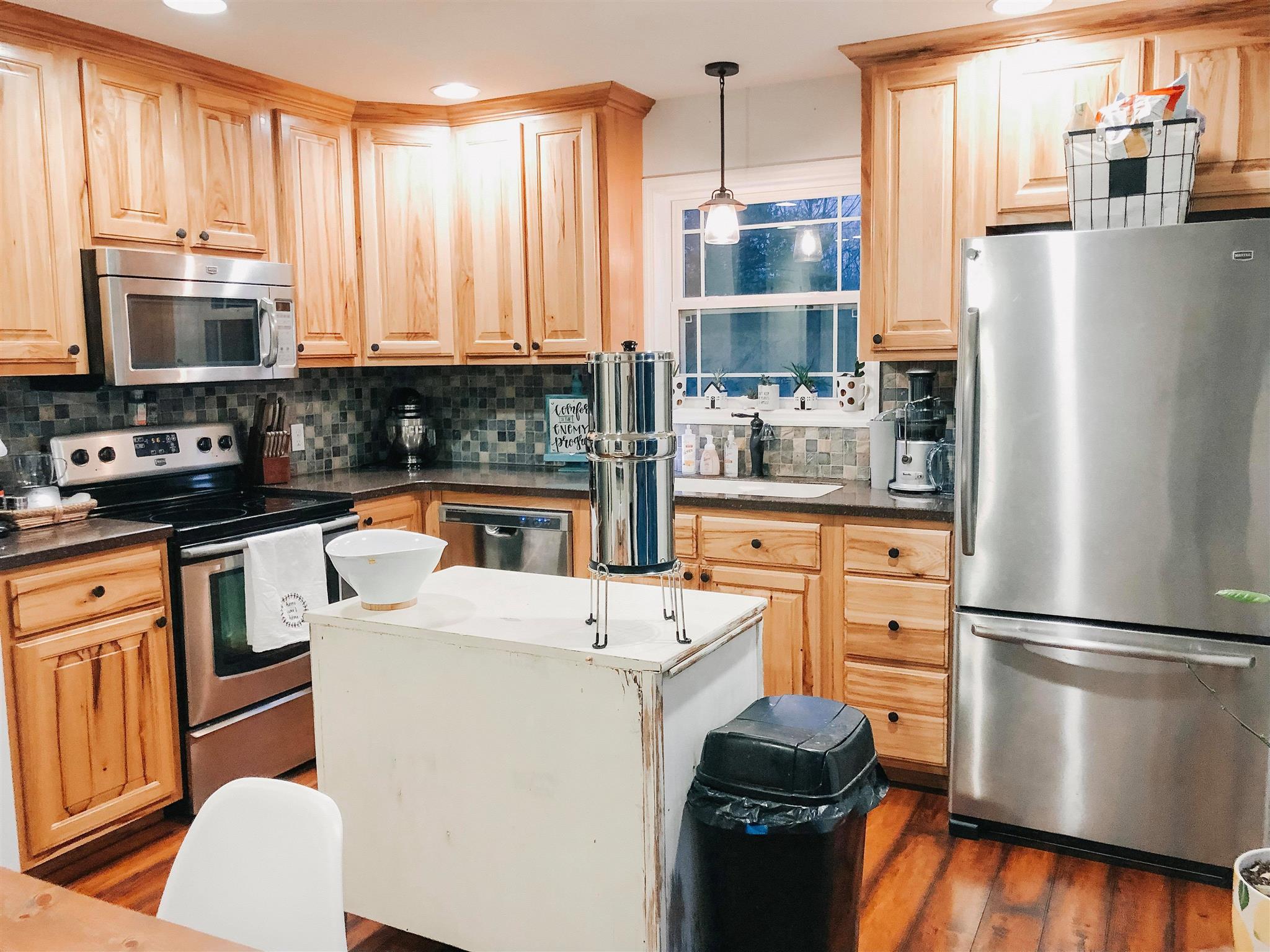 229 Damron Road Estill Springs, TN 37330 - Photo 3 of 15 Country kitchen with hickory cabinets and SS appliances