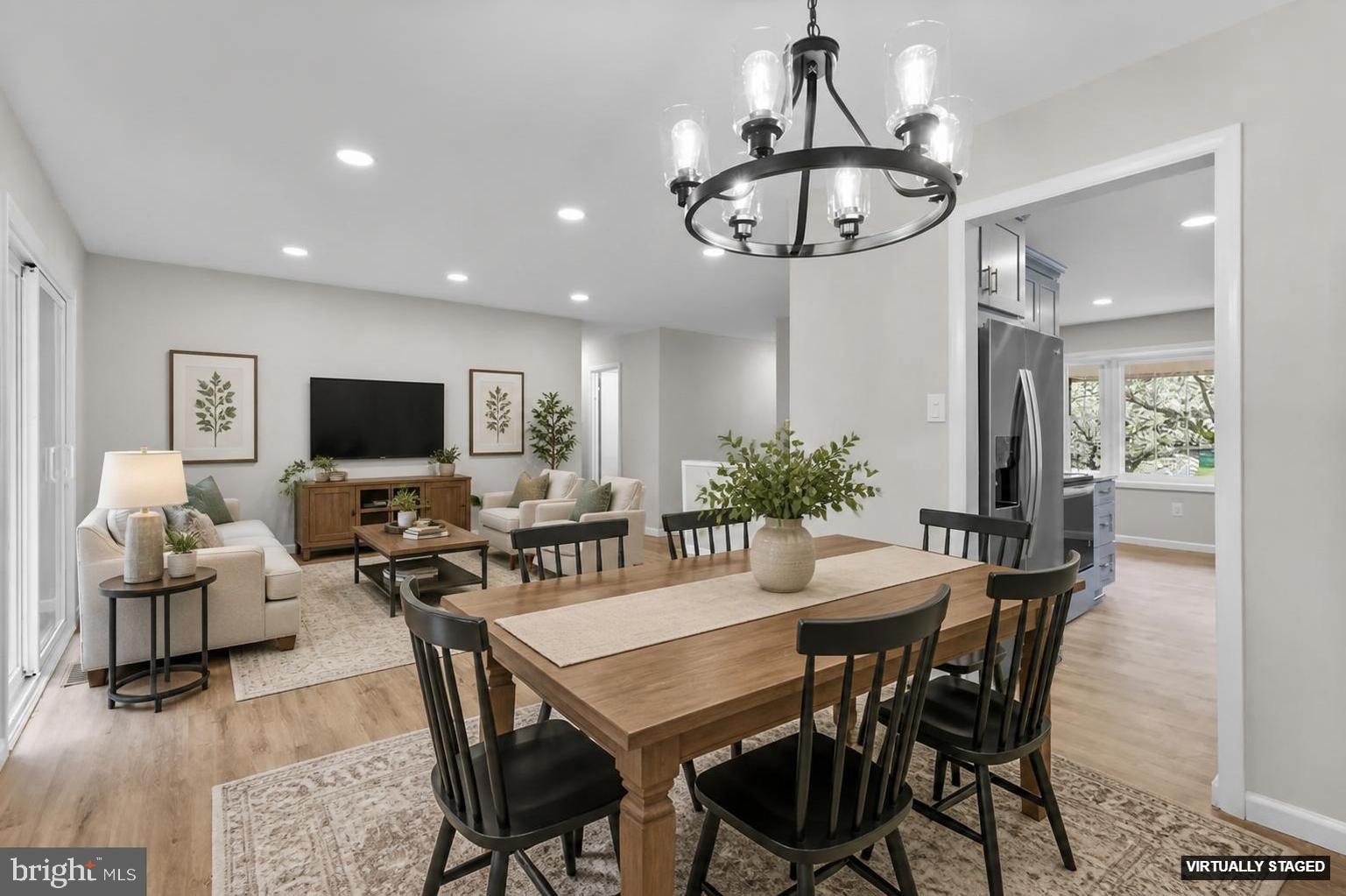 24320 Log House Road Gaithersburg, MD 20882 - Photo 7 of 43 a view of a dining room with furniture and wooden floor