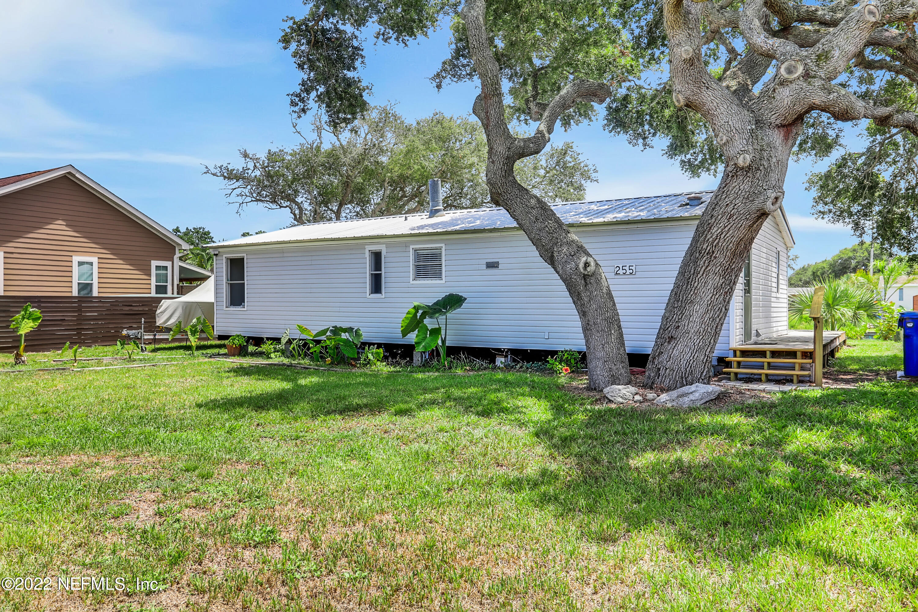 255 Villa Verda Road St. Augustine, FL 32080 - Photo 20 of 36 a view of a house with a yard and tree