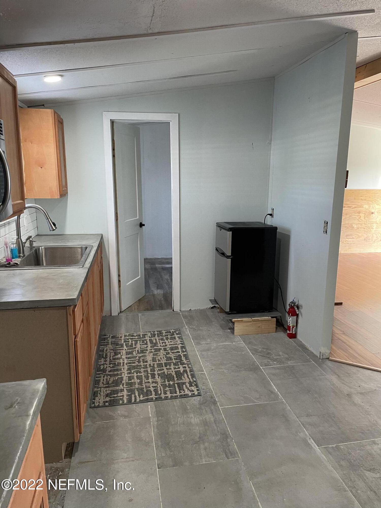 255 Villa Verda Road St. Augustine, FL 32080 - Photo 31 of 36 a bedroom with a bed and a sink