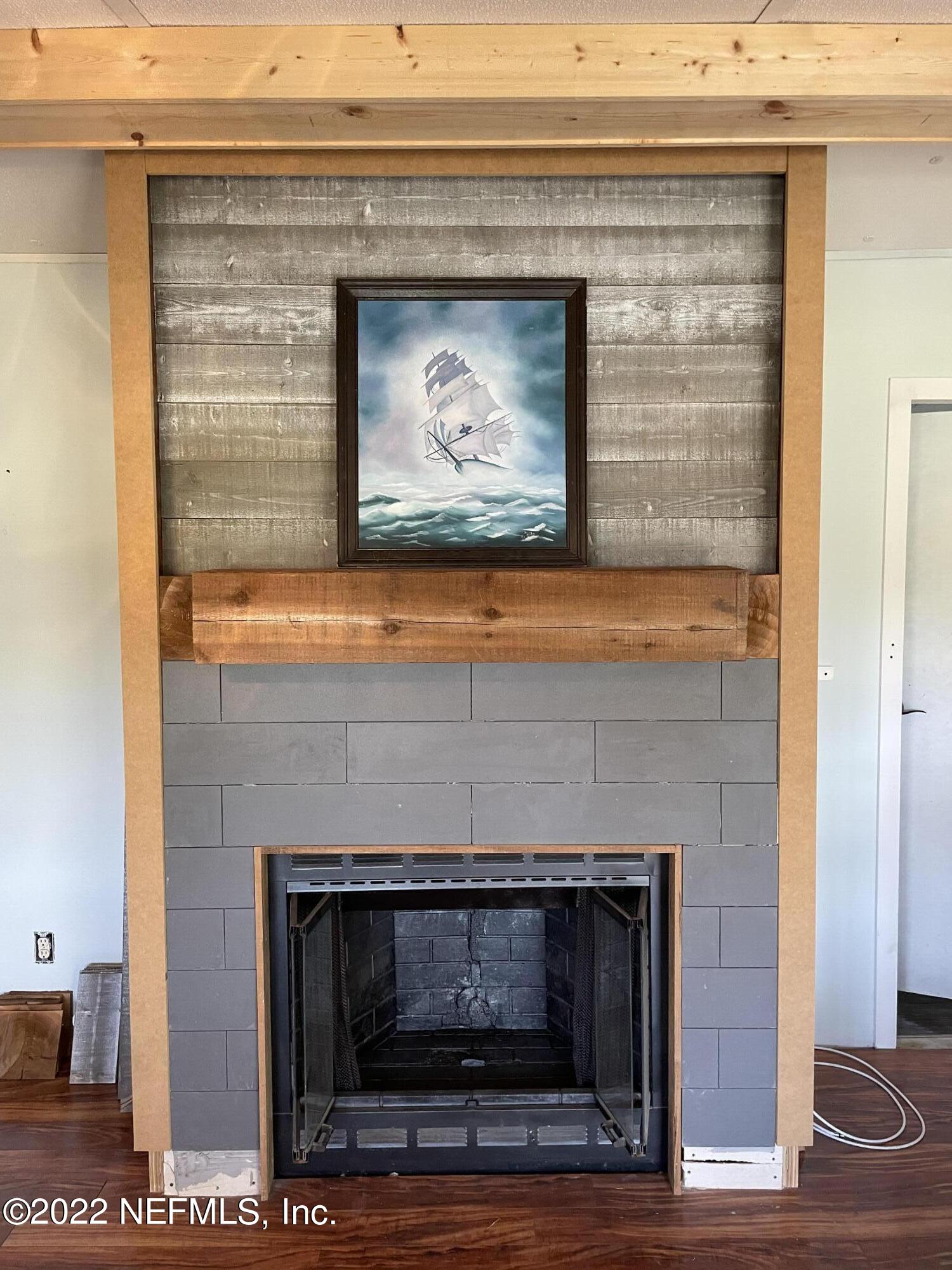 255 Villa Verda Road St. Augustine, FL 32080 - Photo 36 of 36 a fireplace with a hallway