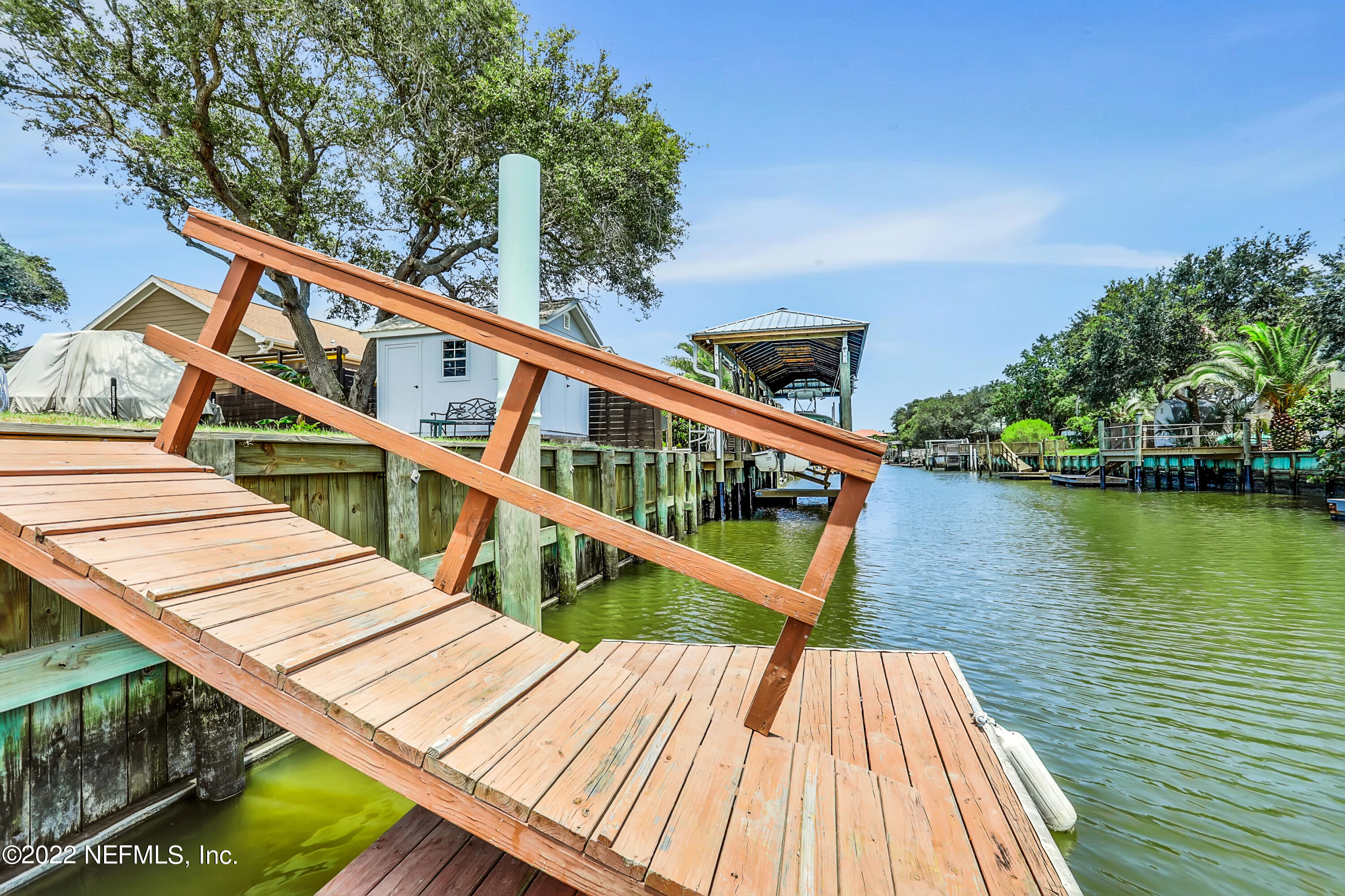 255 Villa Verda Road St. Augustine, FL 32080 - Photo 4 of 36 a view of deck with two chairs and wooden floor