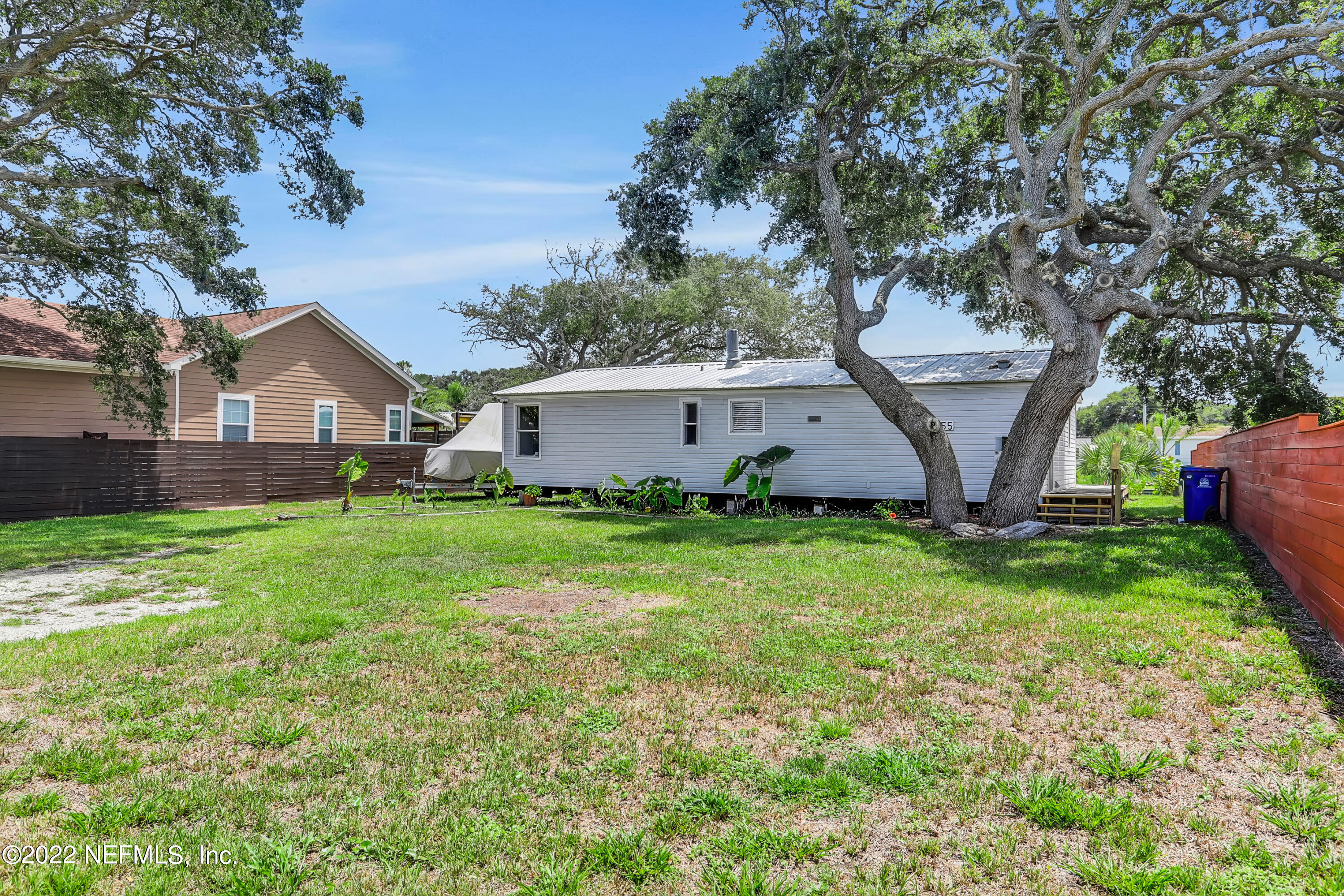 255 Villa Verda Road St. Augustine, FL 32080 - Photo 10 of 36 a view of a house with backyard and a tree