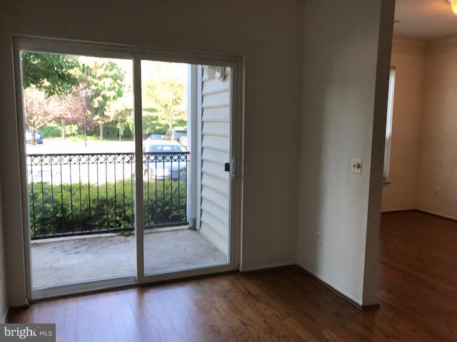 1530 Spring Gate Dr., Unit 9117 McLean, VA 22102 - Photo 11 of 15 Dining Room + glass door to balcony