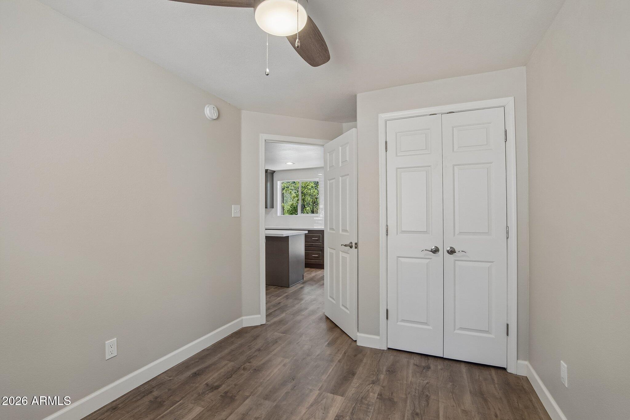 8324 Fossil Creek Road Pine, AZ 85544 - Photo 18 of 29 a view of a room with wooden floor