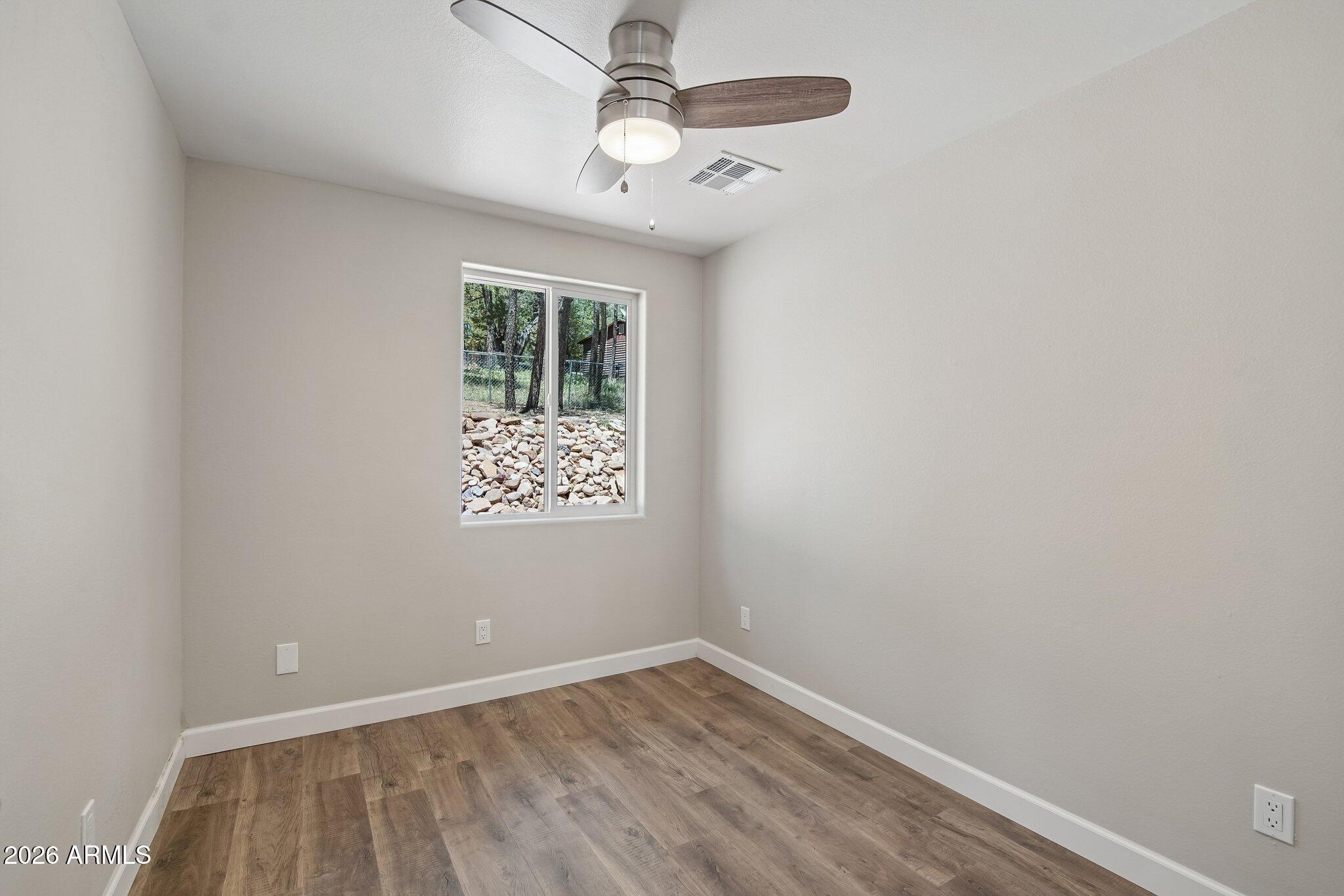 8324 Fossil Creek Road Pine, AZ 85544 - Photo 20 of 29 an empty room with a window