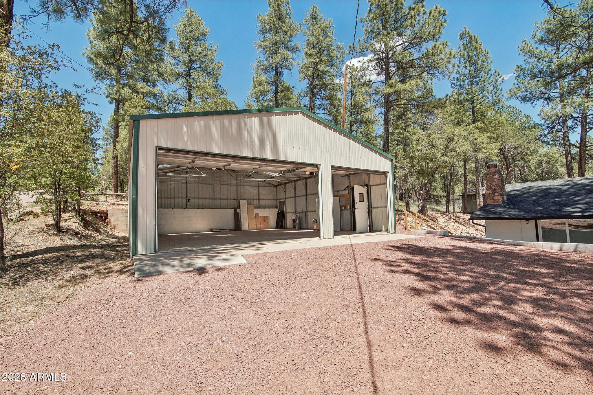 8324 Fossil Creek Road Pine, AZ 85544 - Photo 25 of 29 a view of a house with a yard and tree