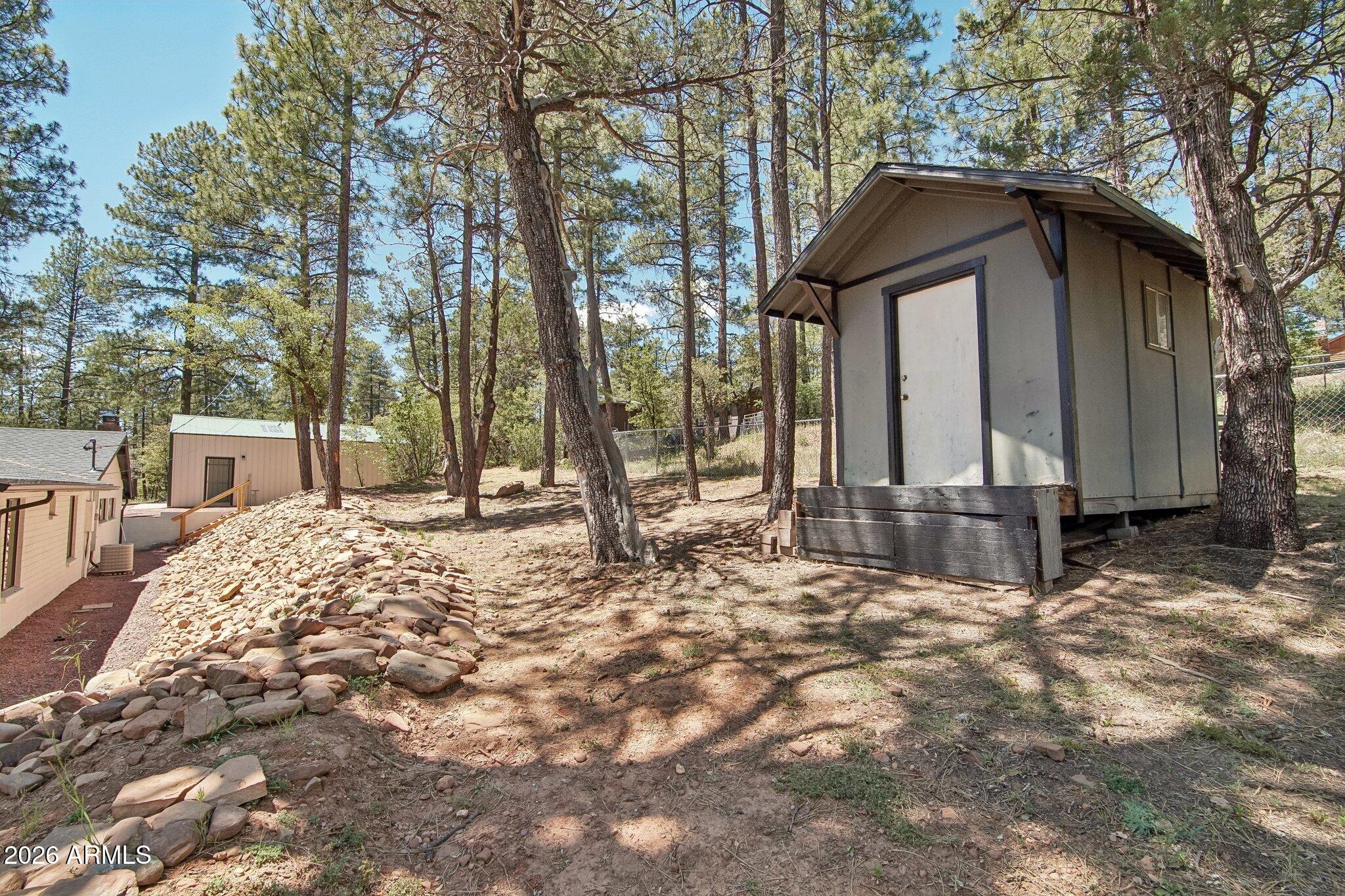 8324 Fossil Creek Road Pine, AZ 85544 - Photo 29 of 29 a house with trees in the background