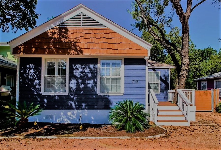 702 West N Loop Boulevard Austin, TX 78751 - Photo 1 of 23 A welcoming front facade showcases shingle siding and a raised porch with neatly manicured landscaping.