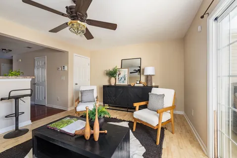 a living room with furniture and a window