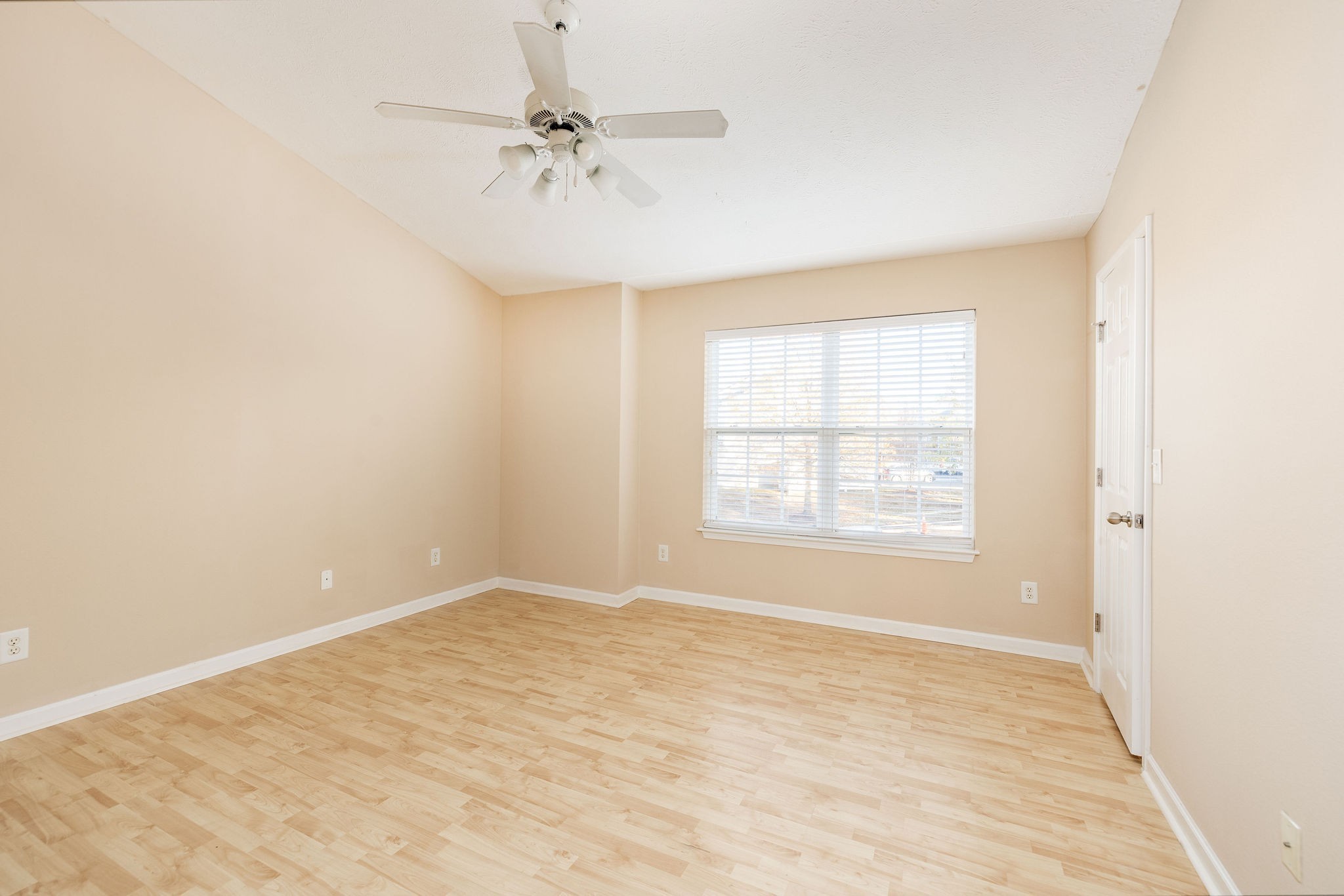 1755 Red Jacket Drive Antioch, TN 37013 - Photo 25 of 37 an empty room with a chandelier fan and windows