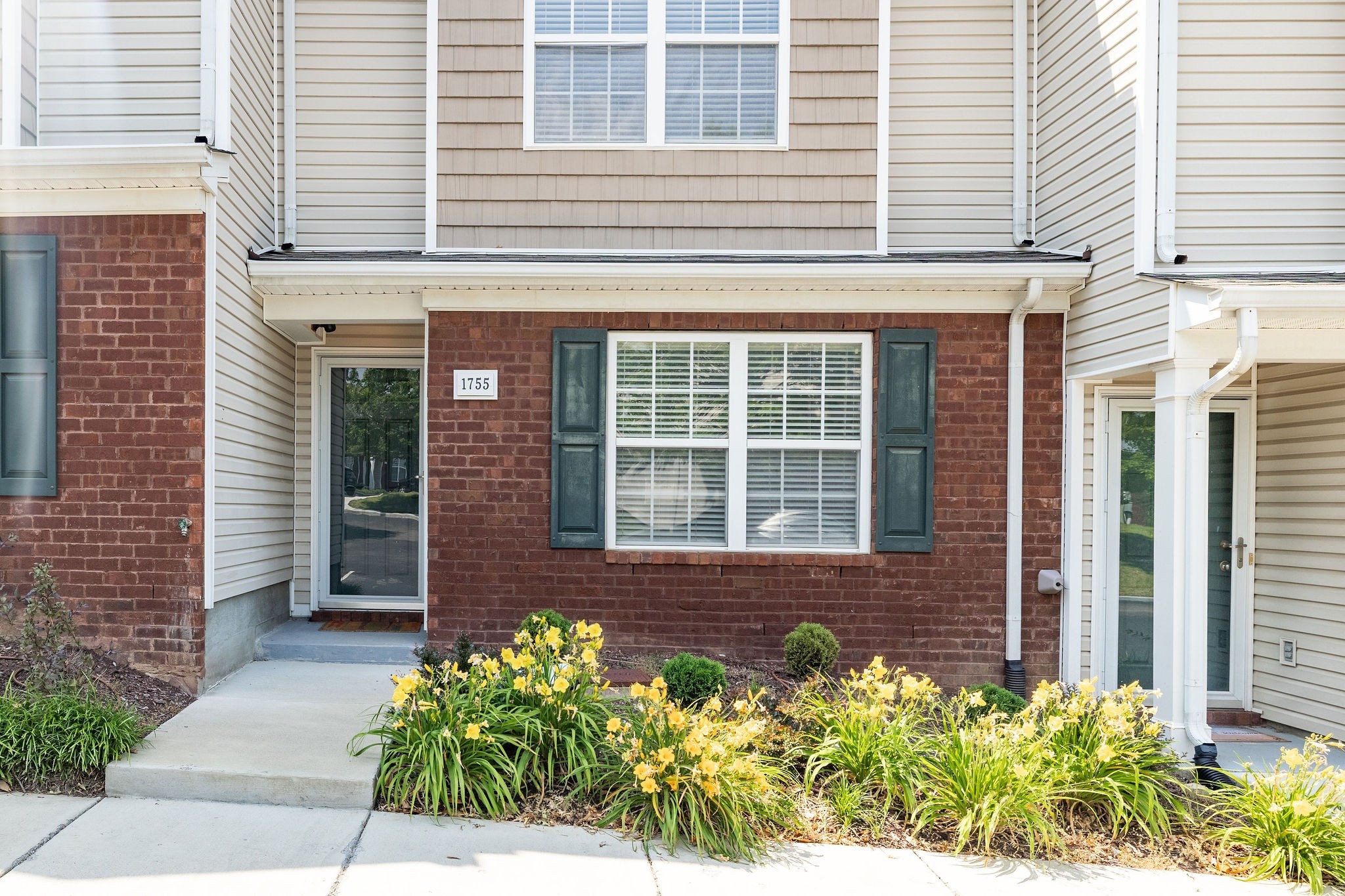 1755 Red Jacket Drive Antioch, TN 37013 - Photo 3 of 37 a front view of a brick house many windows