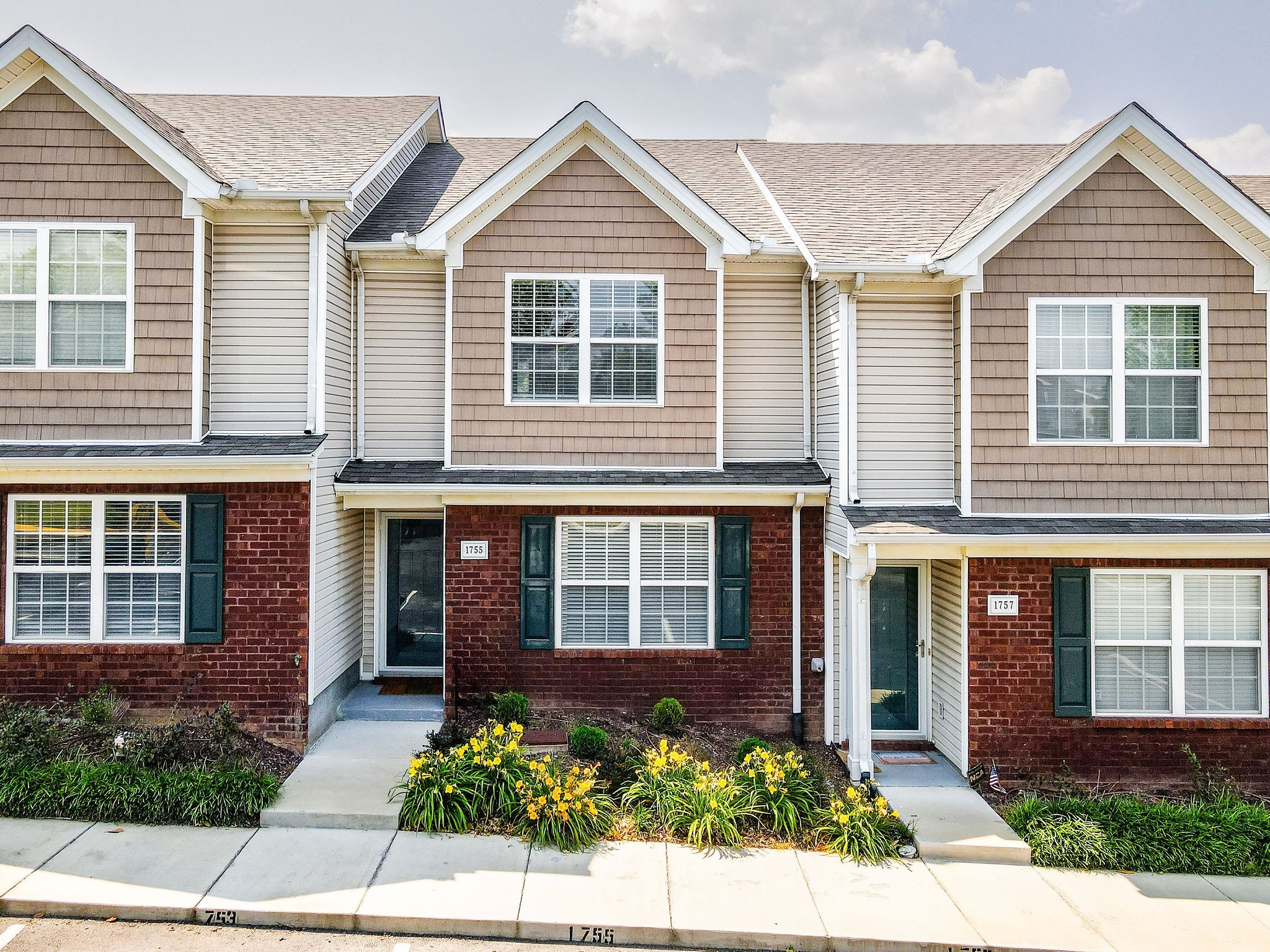 1755 Red Jacket Drive Antioch, TN 37013 - Photo 31 of 37 front view of a brick house and a small yard