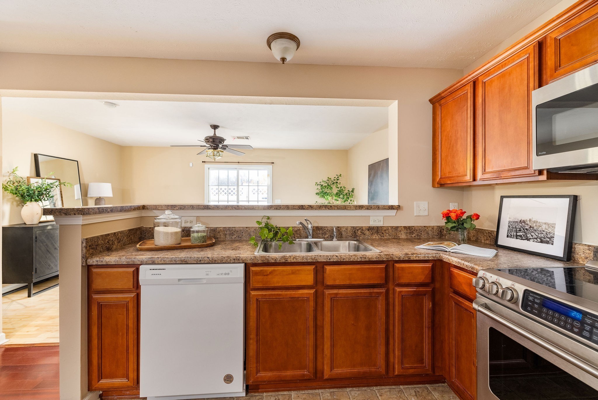 1755 Red Jacket Drive Antioch, TN 37013 - Photo 8 of 37 a kitchen with granite countertop a sink stove and cabinets