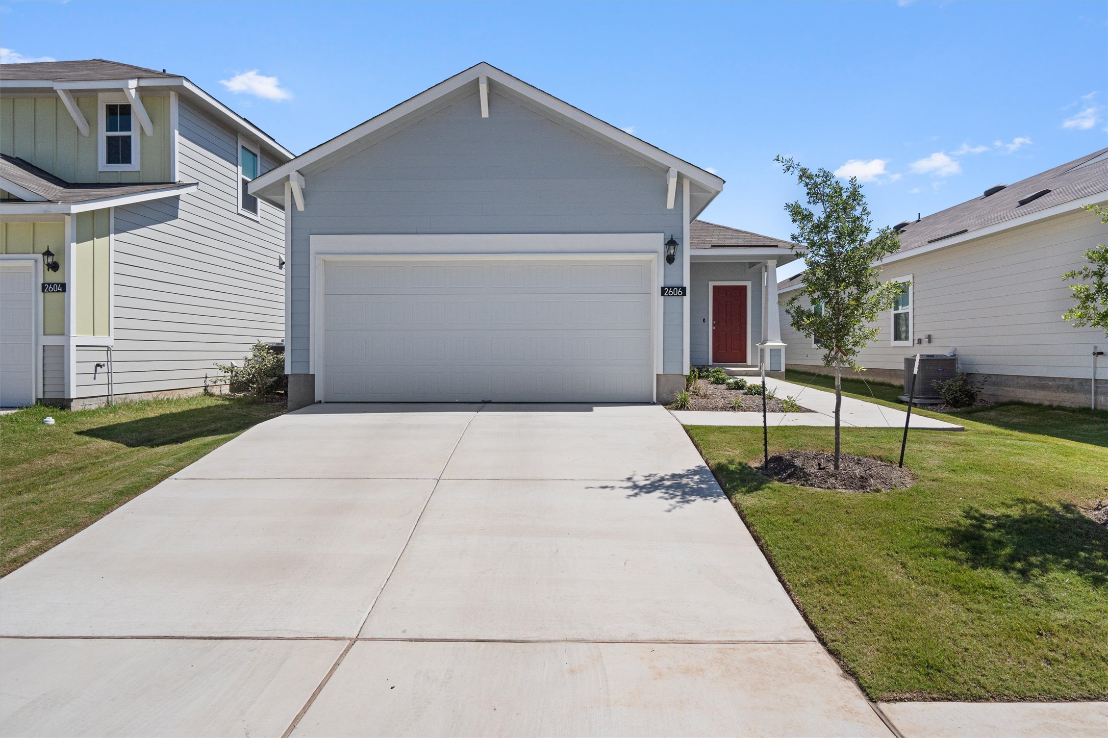 2606 Totley Road Manor, TX 78653 - Photo 2 of 28 a backyard of a house with seating space