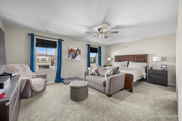 a bed room with a bed and a chandelier