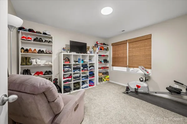 a view of a livingroom with shelves