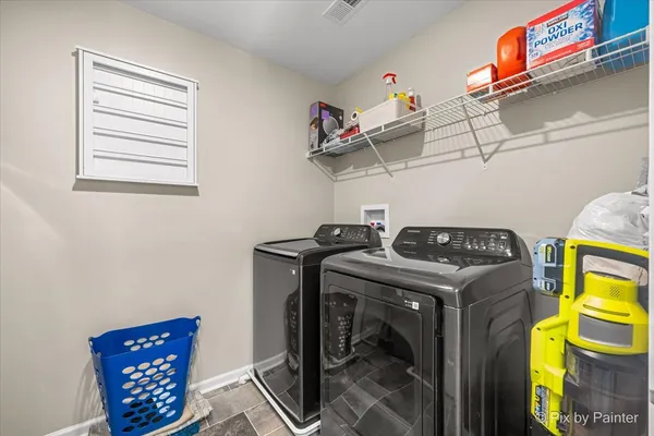 a utility room with dryer and washer