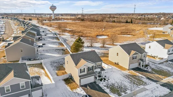 an aerial view of a house with outdoor space