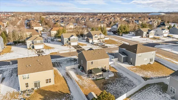 an aerial view of a house with a swimming pool