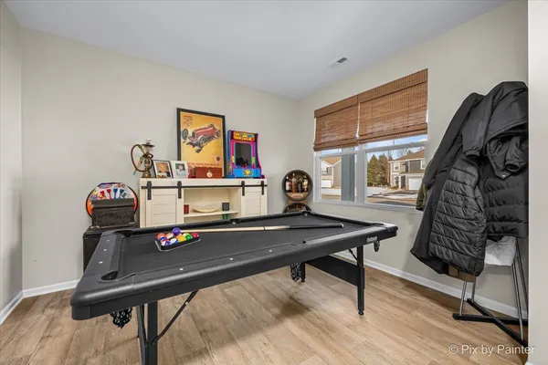 a view of a workspace with furniture and window