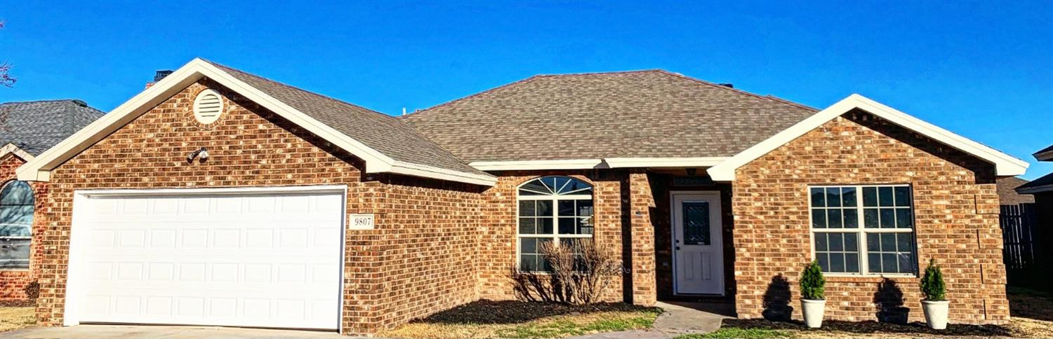 9807 Juneau Avenue Lubbock, TX 79424 - Photo 1 of 22 front view of a house with a yard