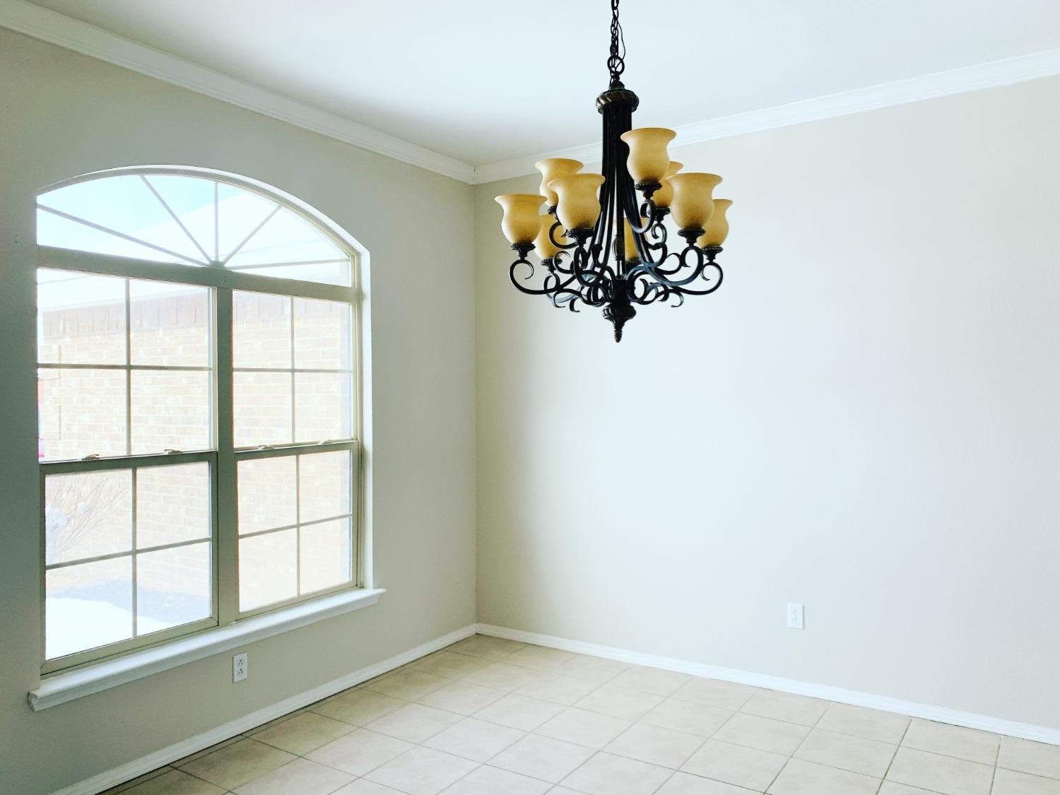 9807 Juneau Avenue Lubbock, TX 79424 - Photo 11 of 22 an empty room with a window