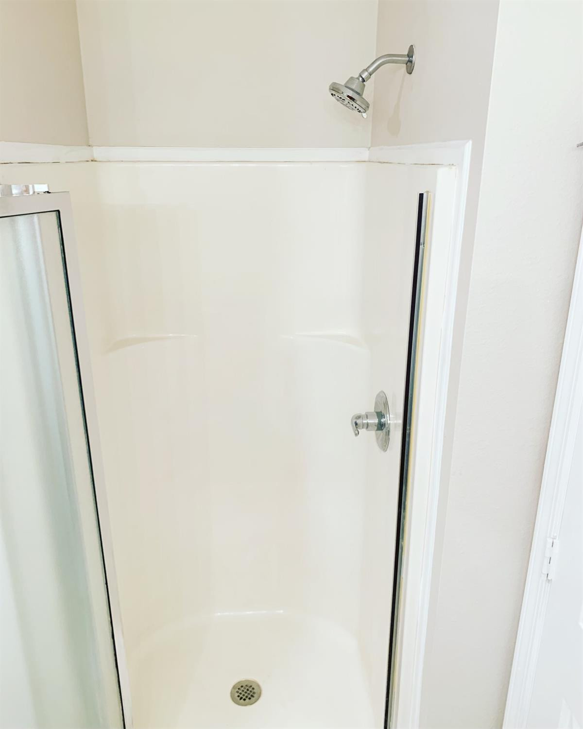 9807 Juneau Avenue Lubbock, TX 79424 - Photo 14 of 22 a bathroom with a shower