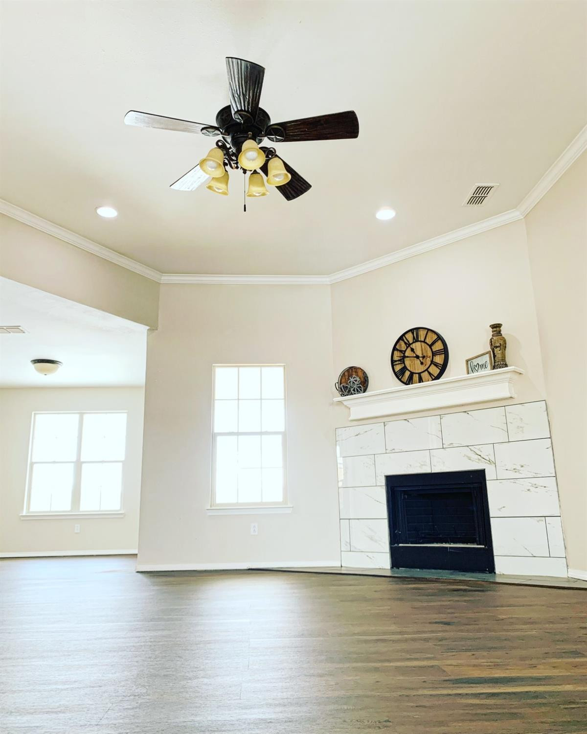9807 Juneau Avenue Lubbock, TX 79424 - Photo 2 of 22 a view of an empty room with a window and fireplace