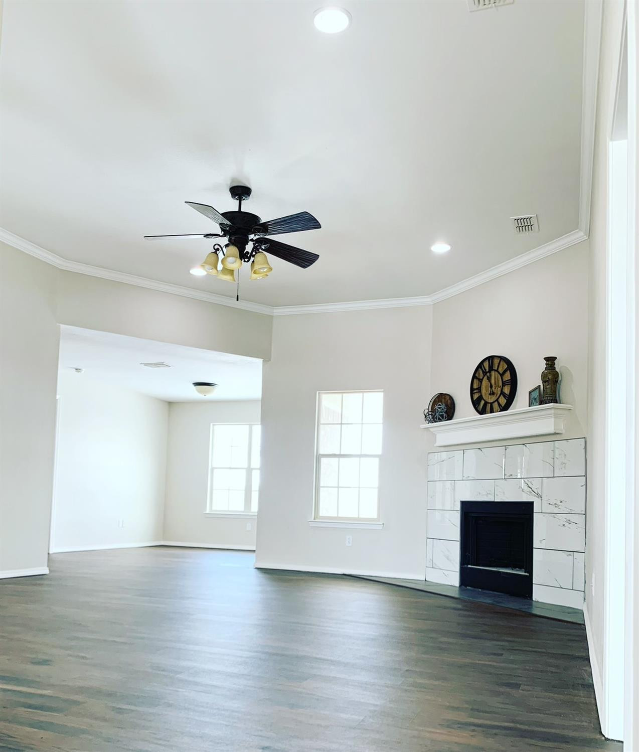 9807 Juneau Avenue Lubbock, TX 79424 - Photo 4 of 22 a view of an empty room with a fireplace and a window