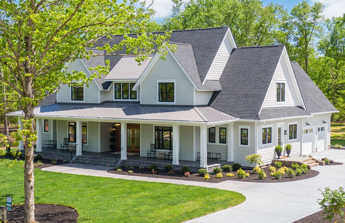 1 Old South Road Murfreesboro, TN 37128 - Photo 2 of 20 a view of a white house with a yard and lawn chairs under an umbrella