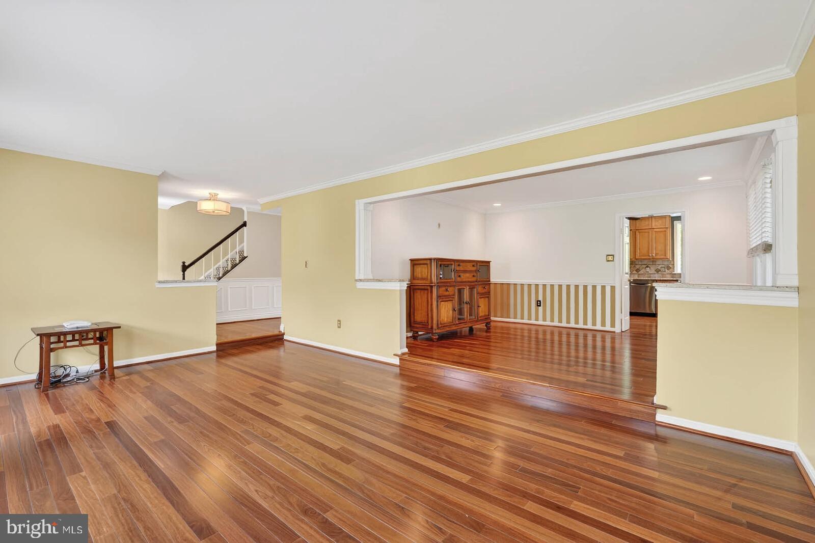2108 Merrifields Drive Silver Spring, MD 20906 - Photo 7 of 69 a view of an empty room with wooden floor and a window