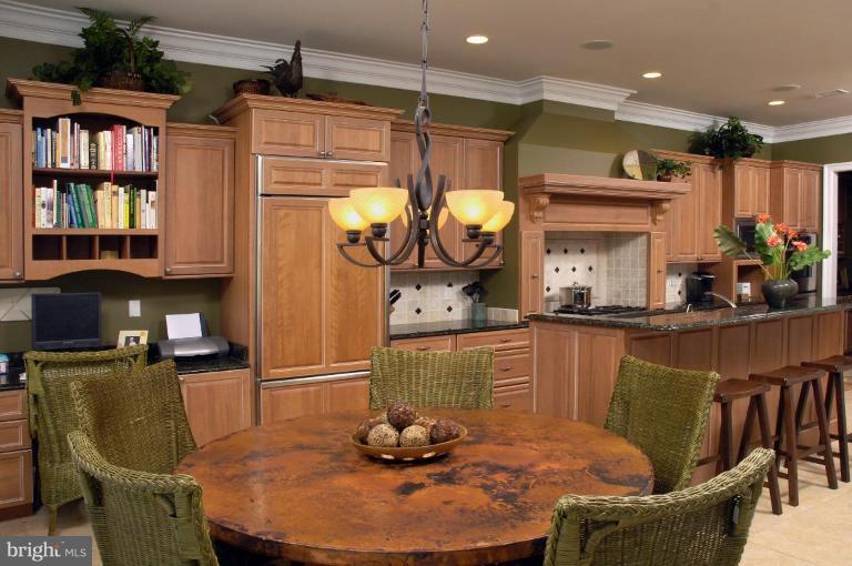 7105 Exfair Road Bethesda, MD 20814 - Photo 2 of 24 a dining room with furniture and window
