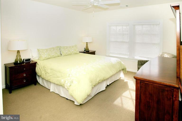 7105 Exfair Road Bethesda, MD 20814 - Photo 11 of 24 a bedroom with a bed and a window