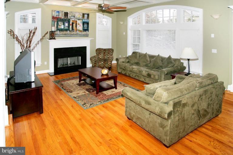 7105 Exfair Road Bethesda, MD 20814 - Photo 13 of 24 a living room with furniture and a fireplace