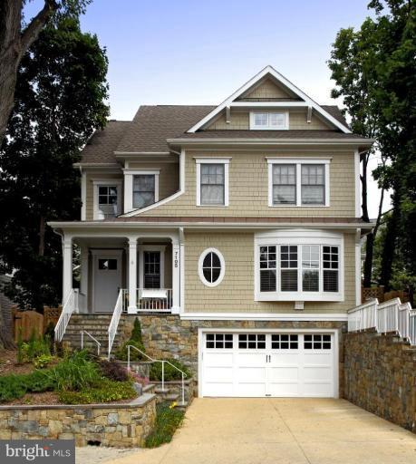 7105 Exfair Road Bethesda, MD 20814 - Photo 21 of 24 a front view of a house with a yard