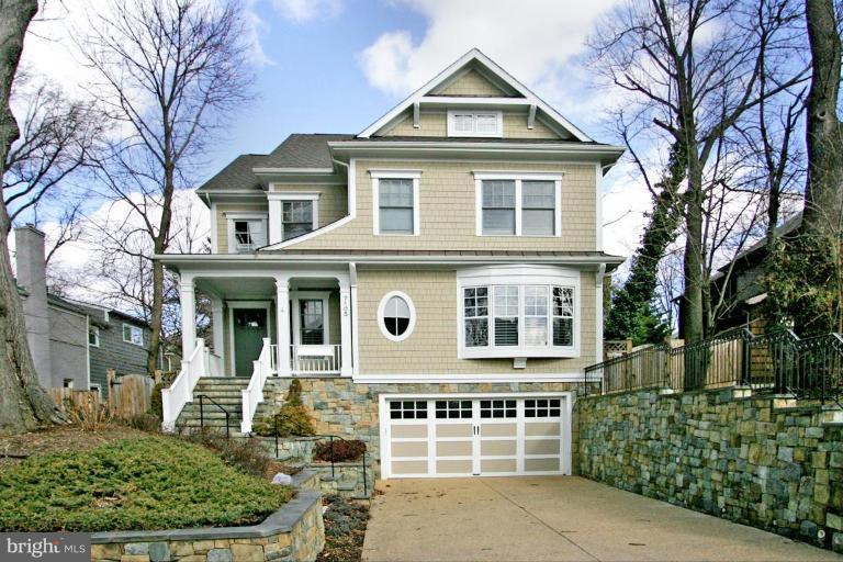 7105 Exfair Road Bethesda, MD 20814 - Photo 4 of 24 a front view of a house with a yard