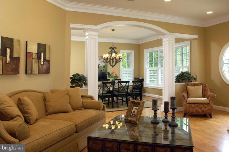 7105 Exfair Road Bethesda, MD 20814 - Photo 5 of 24 a living room with furniture and a chandelier