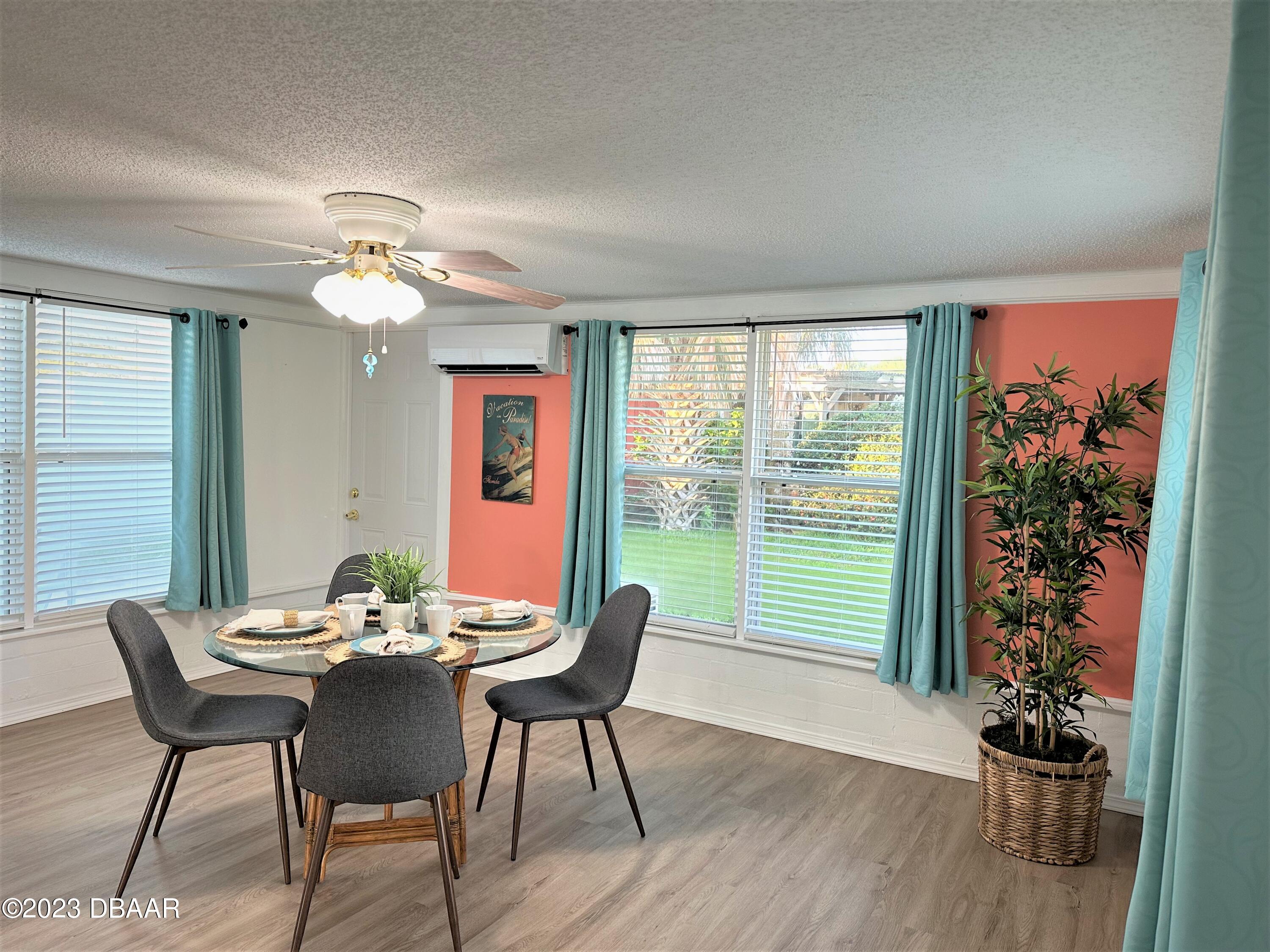 19 Rivershore Drive Ormond Beach, FL 32176 - Photo 12 of 38 a view of a dining room with furniture window and wooden floor