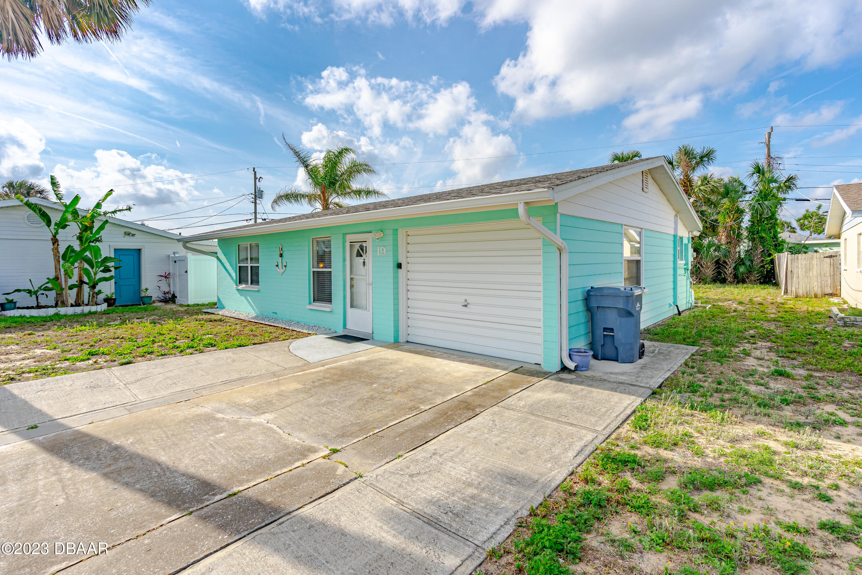 19 Rivershore Drive Ormond Beach, FL 32176 - Photo 4 of 38 a front view of a house with a yard and garage