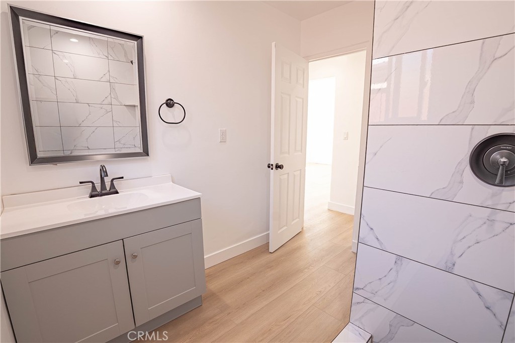 13003 Kamloops Street Pacoima, CA 91331 - Photo 12 of 66 a bathroom with a sink and a mirror