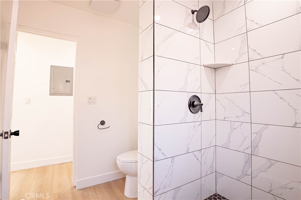 13003 Kamloops Street Pacoima, CA 91331 - Photo 13 of 66 a bathroom with a toilet and a shower