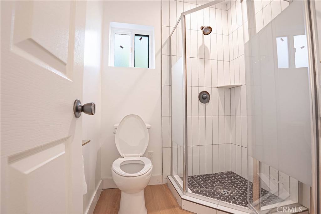 13003 Kamloops Street Pacoima, CA 91331 - Photo 20 of 66 a bathroom with a toilet and a shower