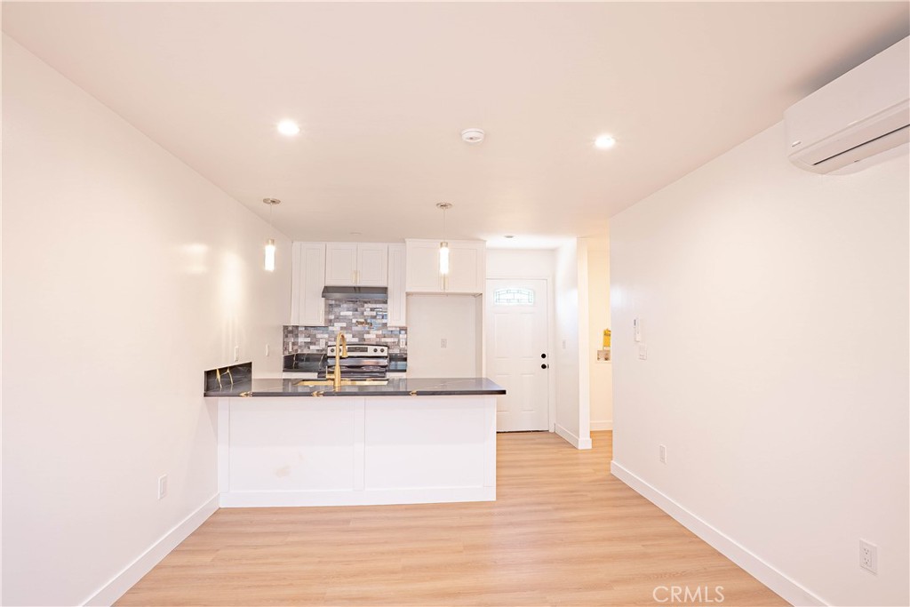 13003 Kamloops Street Pacoima, CA 91331 - Photo 23 of 66 a view of kitchen with wooden floor