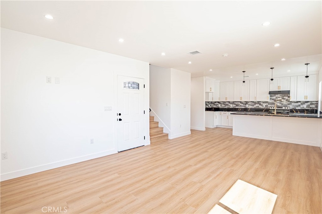 13003 Kamloops Street Pacoima, CA 91331 - Photo 36 of 66 a view of kitchen with wooden floor