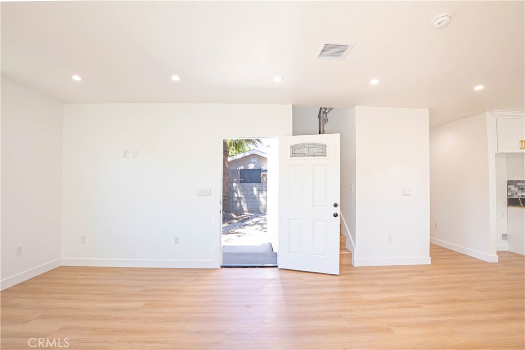 13003 Kamloops Street Pacoima, CA 91331 - Photo 41 of 66 a view of a kitchen with a refrigerator and a stove