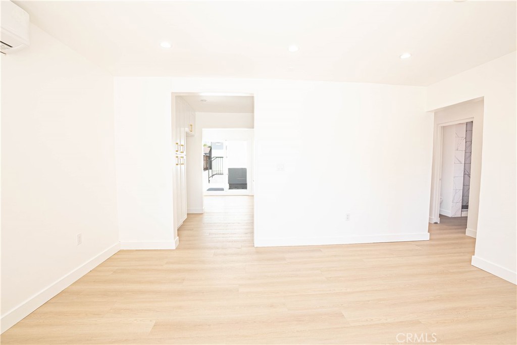 13003 Kamloops Street Pacoima, CA 91331 - Photo 5 of 66 a view of a room with wooden floor